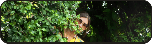 Woman hiding in bushes