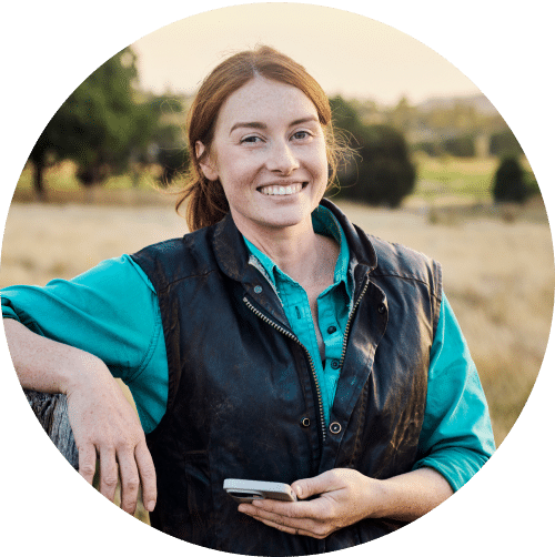 Image of a woman smiling out in the country